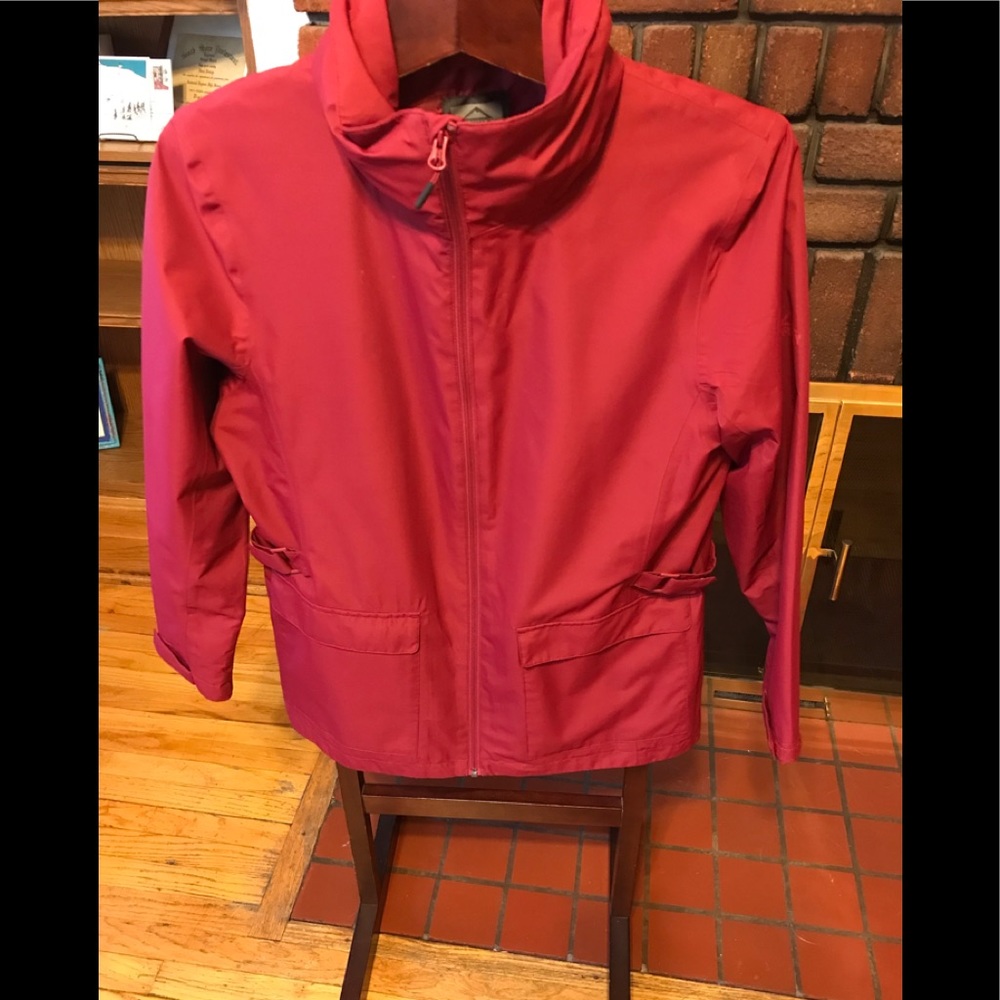 Brand new McKinley wind and waterproof isolated jacket with hidden hood